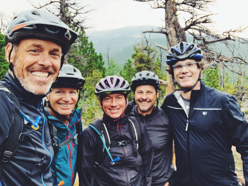 Kevin Gammon MCBC Board second from right with 4 friends smiling wearing helmets