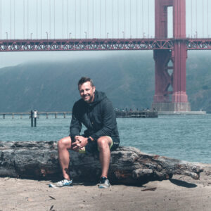 Kevin Gammon MCBC Board sitting on rocks with the Golden Gate Bridge in the background