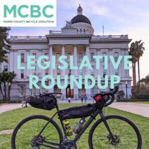 Black touring bike in front of the California Capitol building