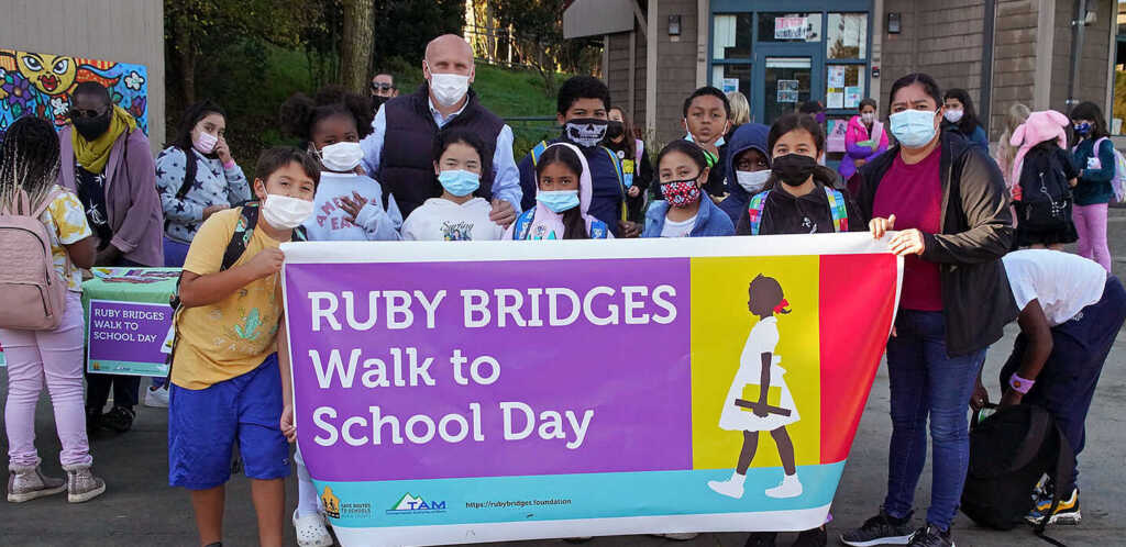 Ruby Bridges Day banner with students and principal