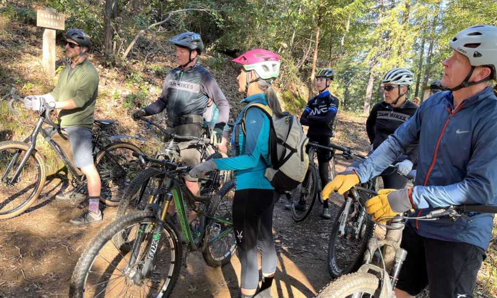 Mountain bike riders stopped on a trail Marin Water District
