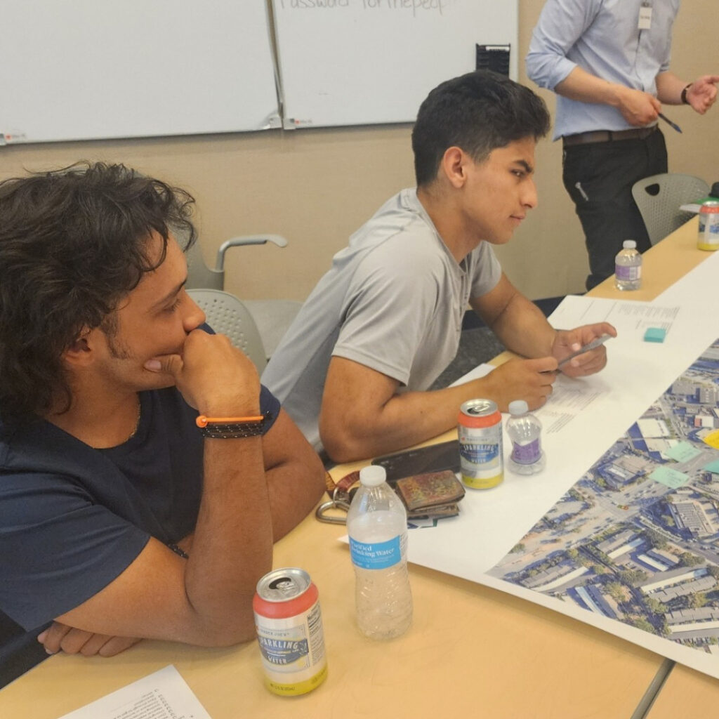 Cory's ride student interns (2) with map of Bellam Blvd.