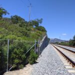 Existing conditions of SMART rail corridor near Hanna Ranch with tracks and hillside.