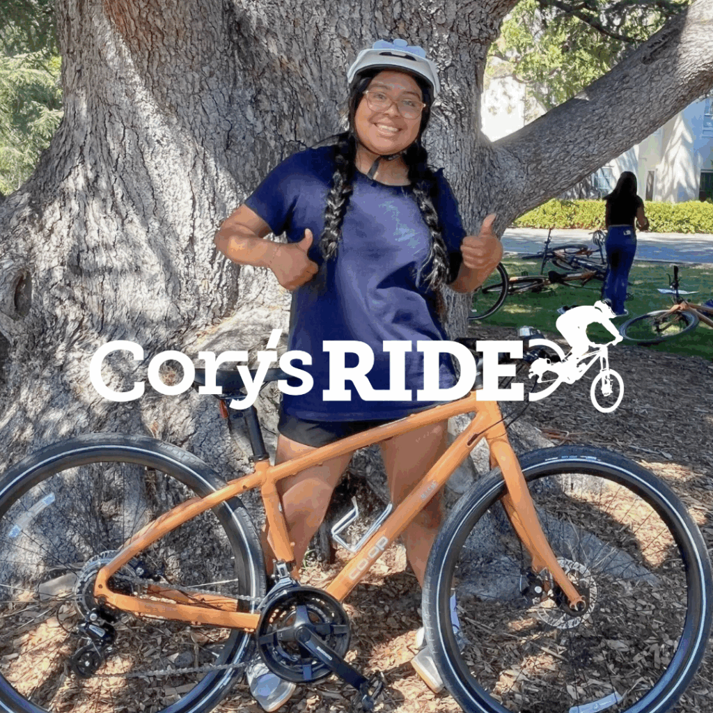 Cory's Ride student with new orange bike