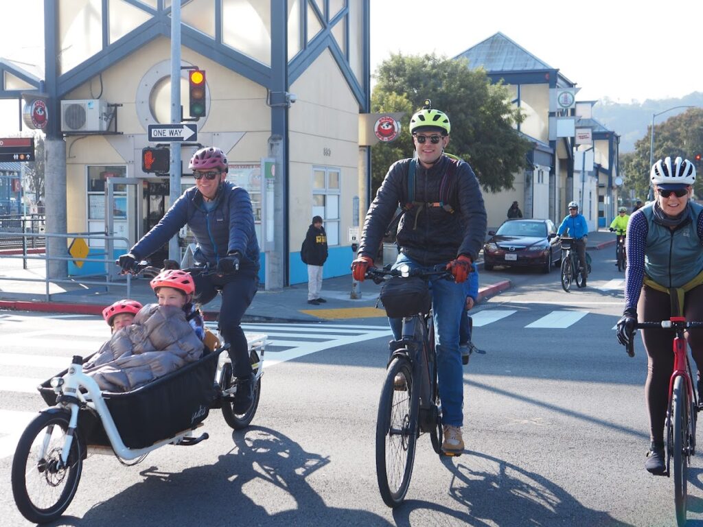 Parents riding bicycles with kids in Downtown San Rafael