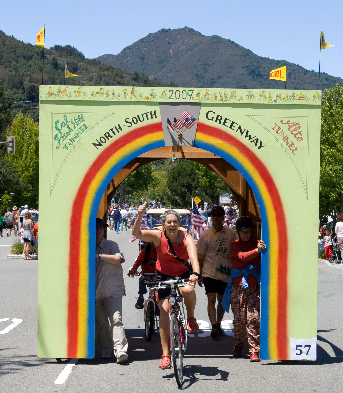Bicyclist riding through the Alto Tunnel float with Mt Tam in background