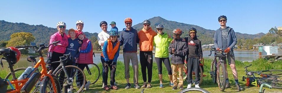 Cyclists Standing in Front of Mt. Tam